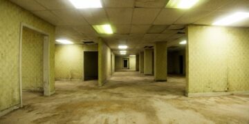 Cuartos vacíos con paredes amarillas y luz fluorescente, al estilo de los Backrooms